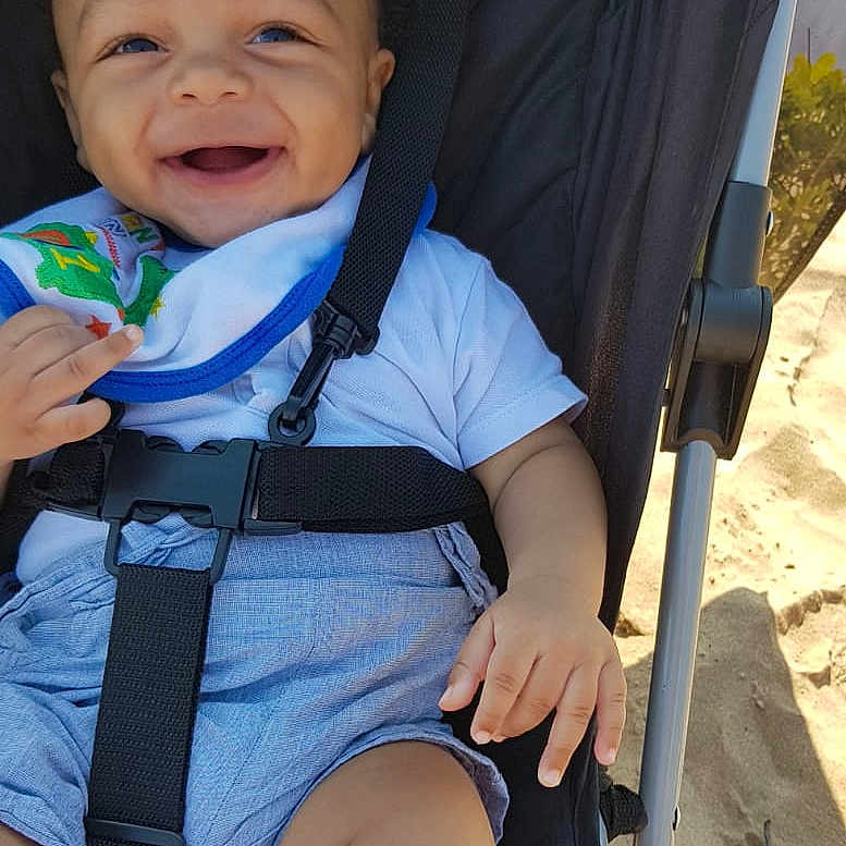 Kobie is registered to the contest to win money with this photo: accessories, baby, bag, clothing, cream, dessert, face, food, happy, head, icecream, outdoors, pants, person, photography, portrait, shorts, stroller, summer, t_shirt