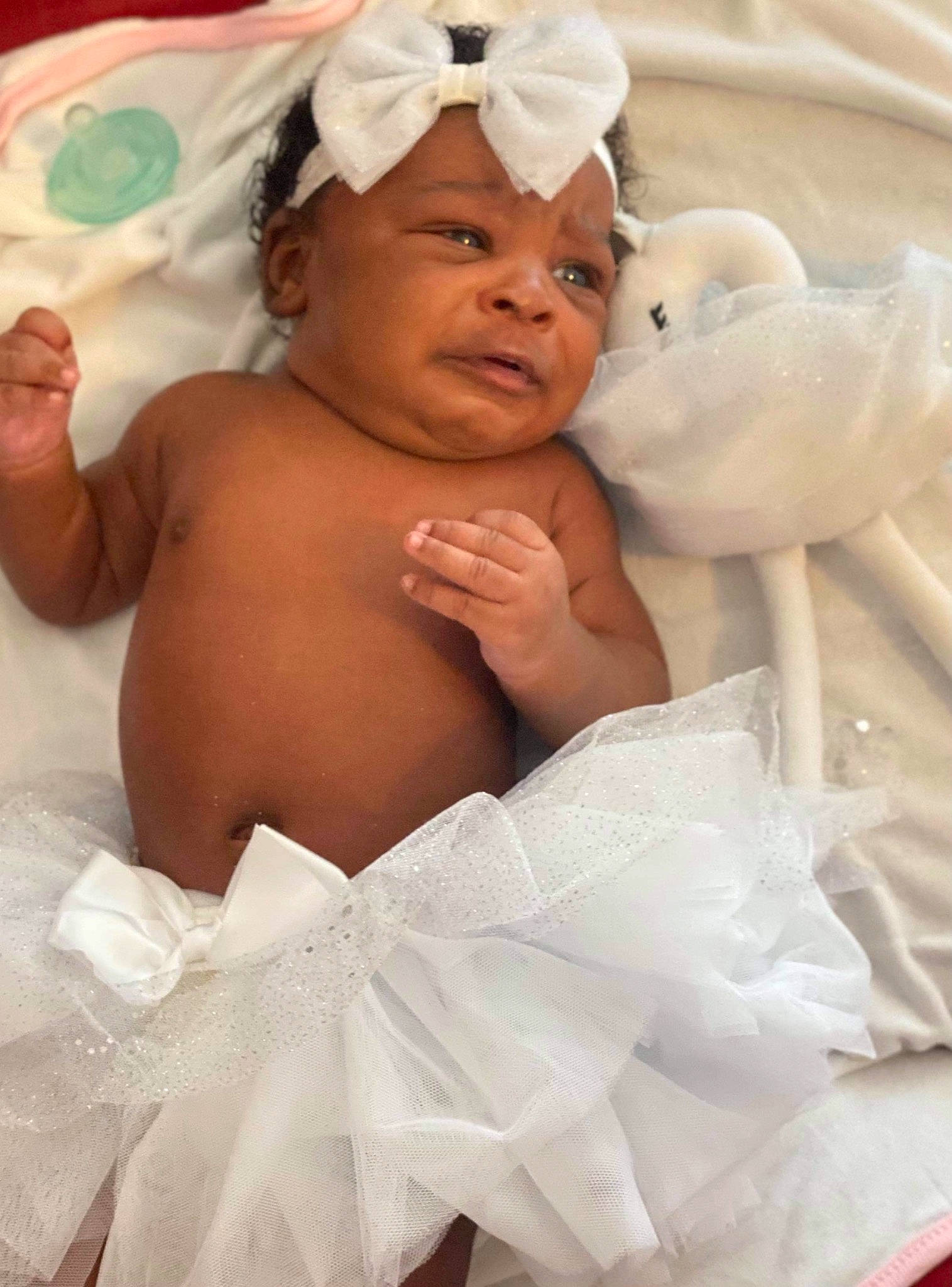 Ashayla is registered to the contest to win money with this photo: abdomen, baby, barechested, cap, chest, comfort, face, gesture, happy, head, headgear, headwear, muscle, person, pink, skin, smile, textile, thumb, toddler