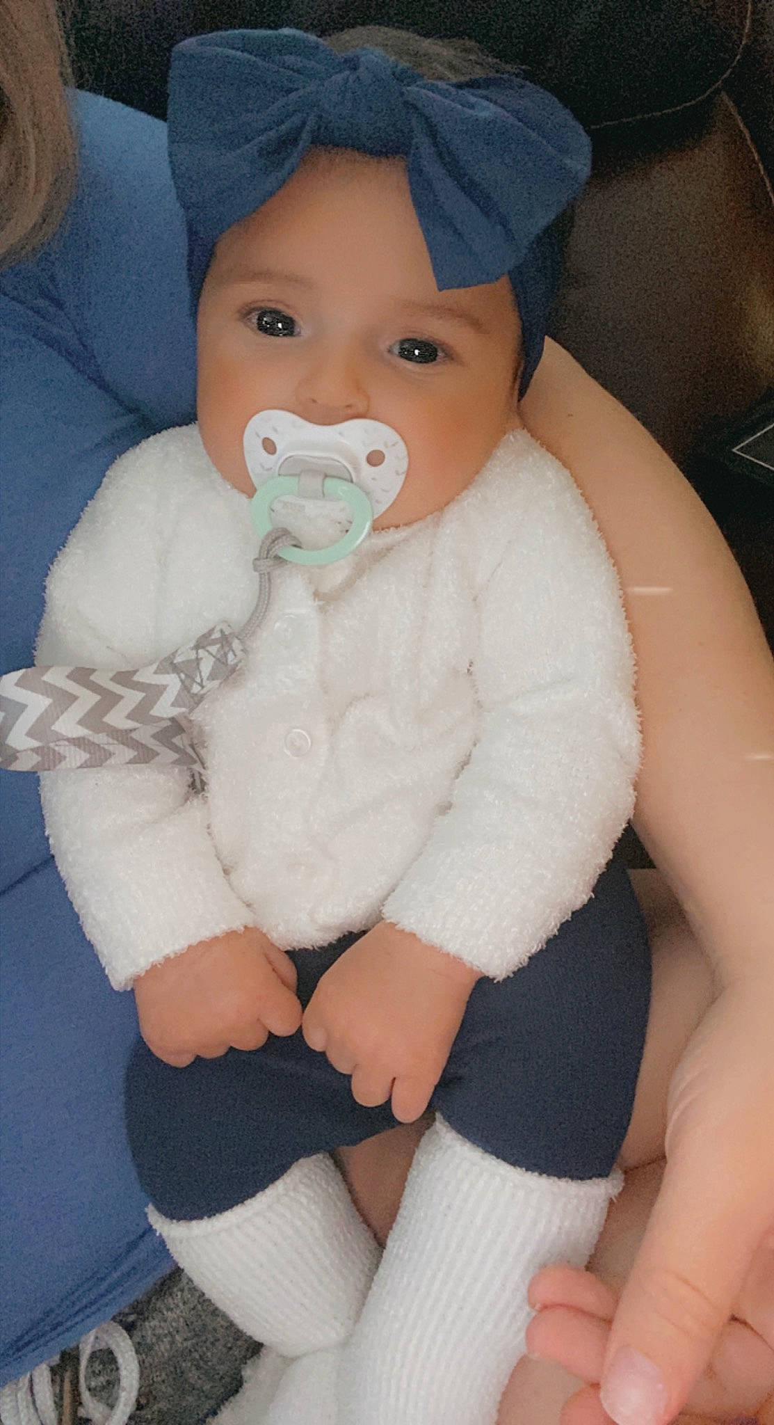 Avayah is registered to the contest to win money with this photo: baby, baby_toddler_clothing, cheek, comfort, eye, finger, hairstyle, head, headwear, human_body, mouth, muscle, neck, nose, organ, outerwear, person, plastic_bottle, skin, sleeve