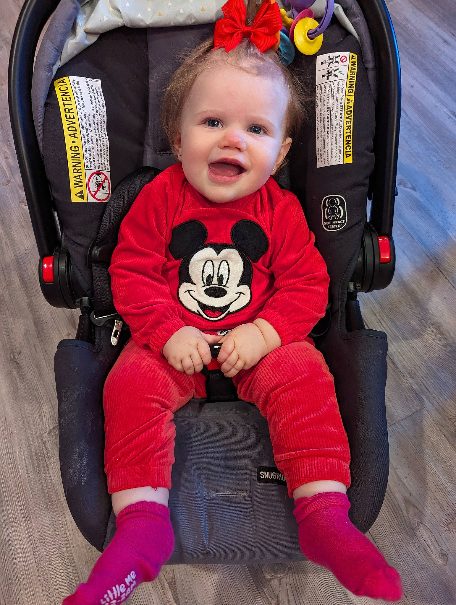 Peyton is registered to the contest to win money with this photo: baby, baby_carriage, baby_products, baby_toddler_clothing, bag, chair, child, comfort, fashion_accessory, fun, happy, lap, outerwear, person, personal_protective_equipment, pink, sitting, sleeve, smile, toddler