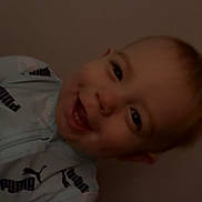 Kacey is registered to the contest to win money with this photo: toddler, child, smiling, face, head, clothing, jacket, puma, happy, portrait, indoor, person, cute, young_child, joy, casual, light, expression, baby, human