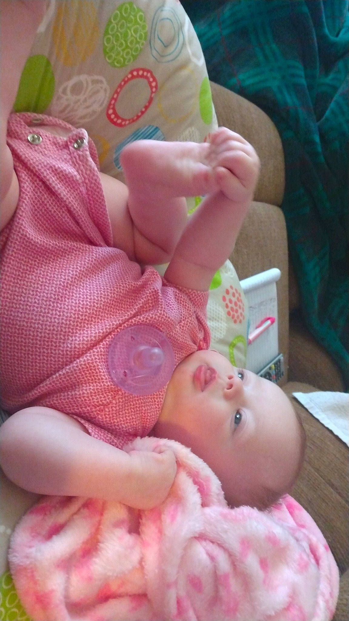 Lani is registered to the contest to win money with this photo: arm, baby, baby_products, baby_sleeping, baby_toddler_clothing, cheek, child, comfort, finger, foot, human_body, linens, mouth, nail, nose, person, pink, skin, textile, thumb