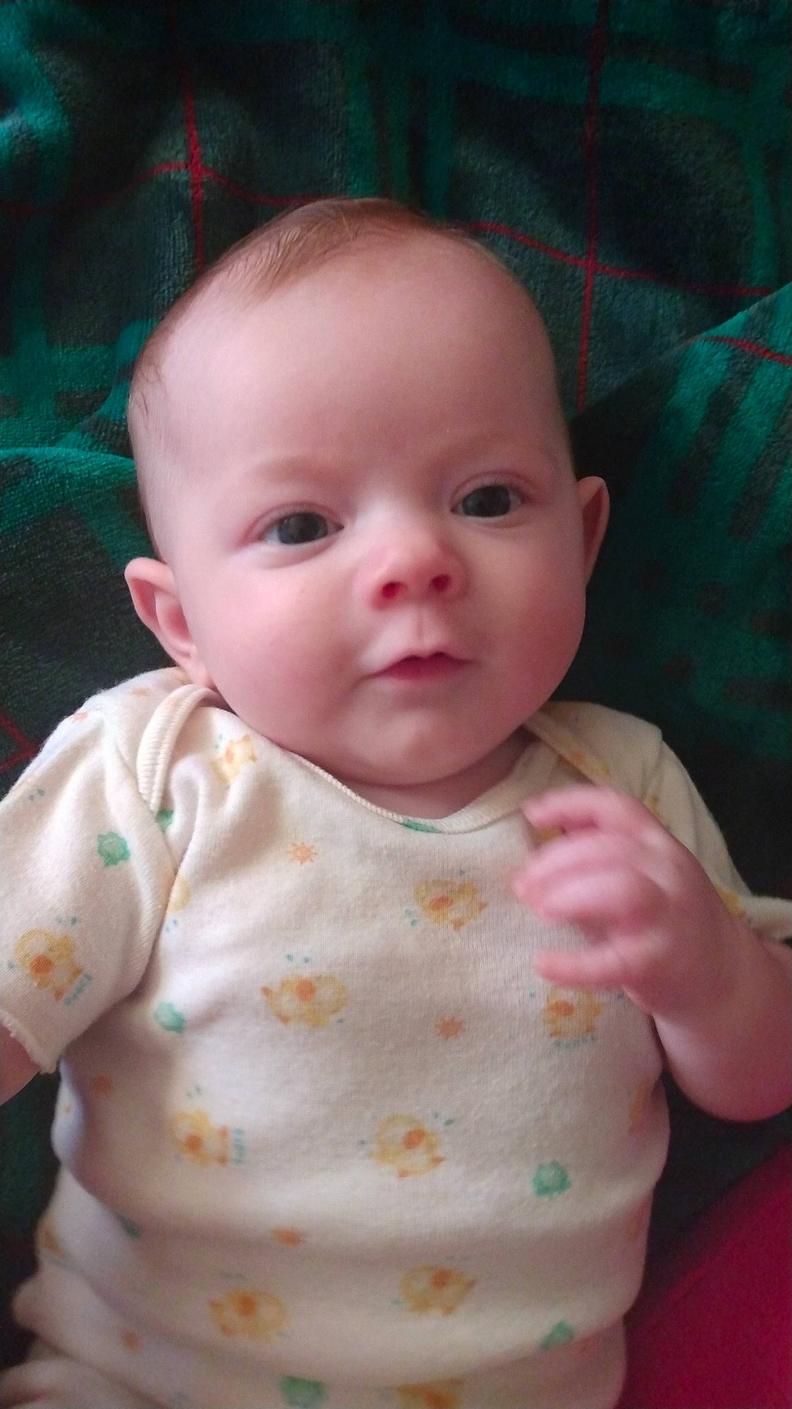 Lani is registered to the contest to win money with this photo: baby, baby_toddler_clothing, bib, cheek, child, chin, dress, eyelash, happy, iris, lip, mouth, nose, organ, peach, person, pink, sitting, skin, sleeve