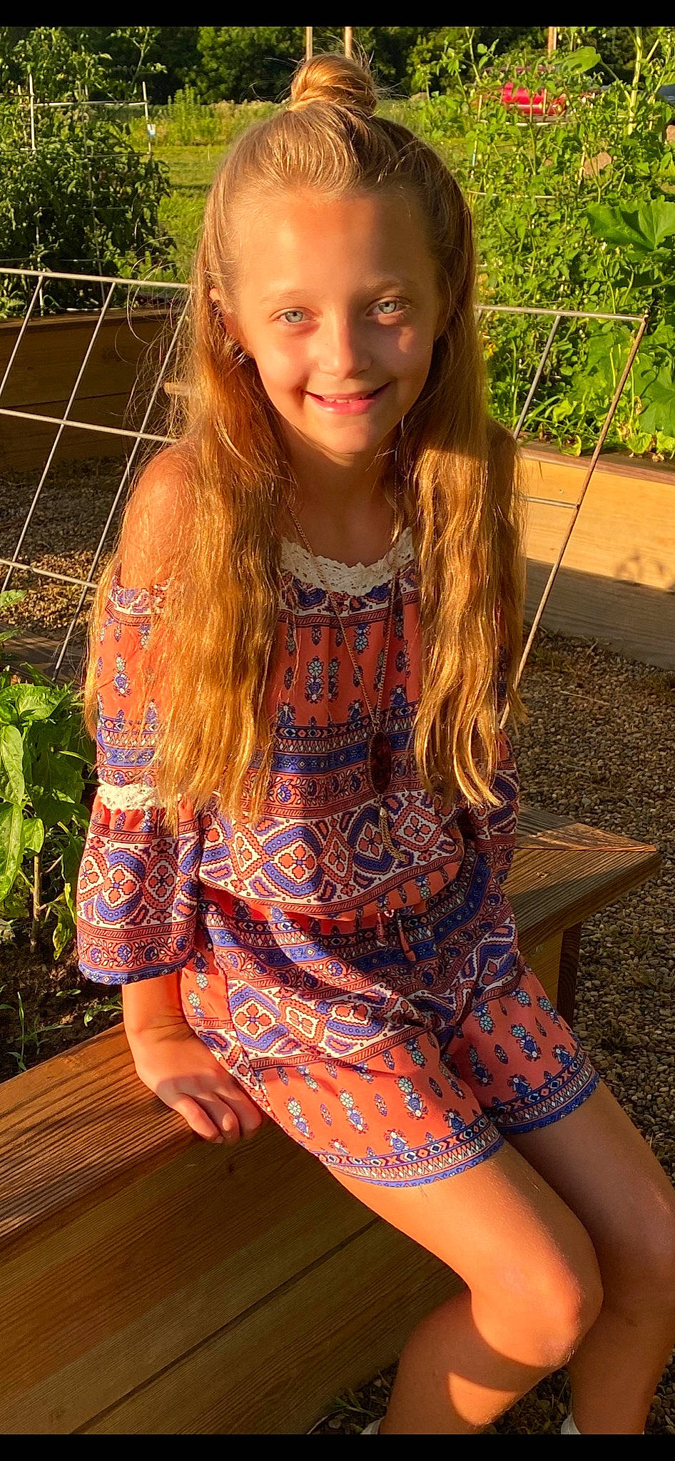 Olivia joined the competition — help win amazing prizes! beauty, blond, child, child_model, design, dress, hair, hairstyle, joy, leg, long_hair, motif, orange, paisley, pattern, person, sitting, smile, summer, textile