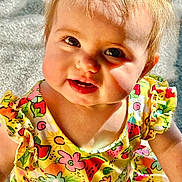 Athena joined the competition — help win amazing prizes! apparel, baby, child, closeup, colorful, cute, dress, eyes, face, flower, fruit, hair, happy, infant, pattern, portrait, shadow, skin, smiling, sunlight