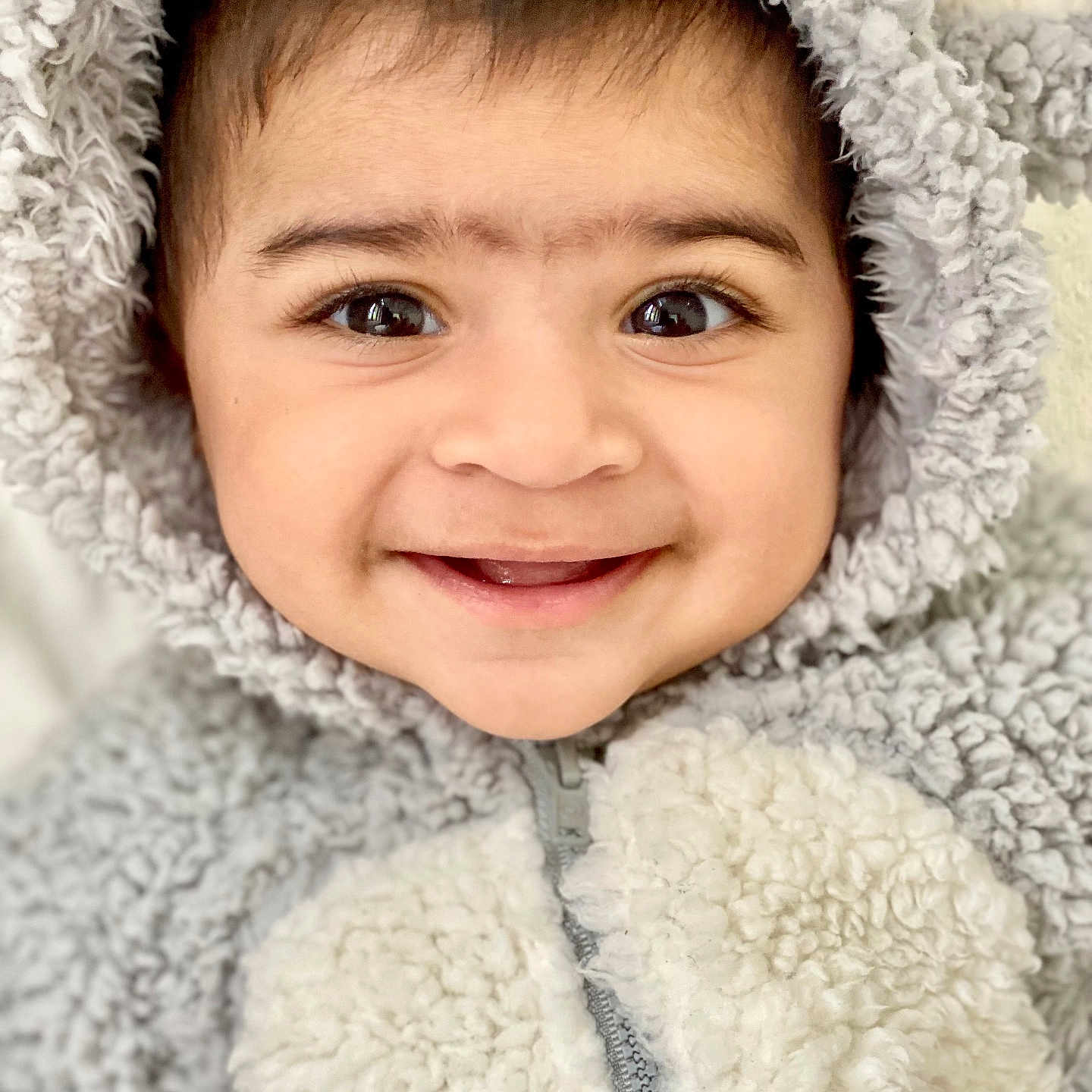 Thaba joined the competition — help win amazing prizes! baby, baby_fashion, child, closeup, cozy, cute, expression, eyes, face, fluffy, fuzzy_clothing, happy, hoodie, infant, portrait, skin, smiling, warm_clothing, young_child, zipped_jacket