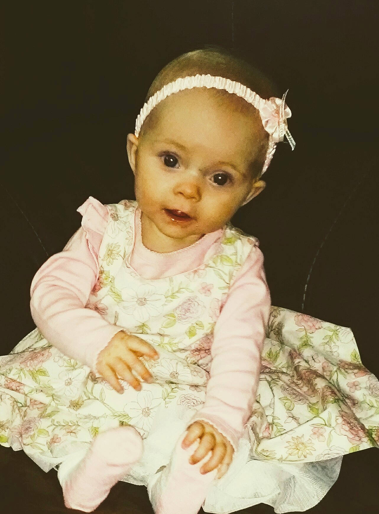 Laney is registered to the contest to win money with this photo: baby, baby_toddler_clothing, cheek, child, child_model, dress, fashion_accessory, forehead, hair_accessory, head, headband, headgear, headpiece, lace, person, photography, pink, sleeve, smile, toddler