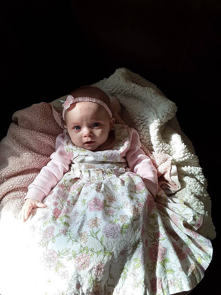 Alannah is registered to the contest to win money with this photo: baby, child, eye, fur, linens, person, photography, sitting, skin, smile, textile, toddler