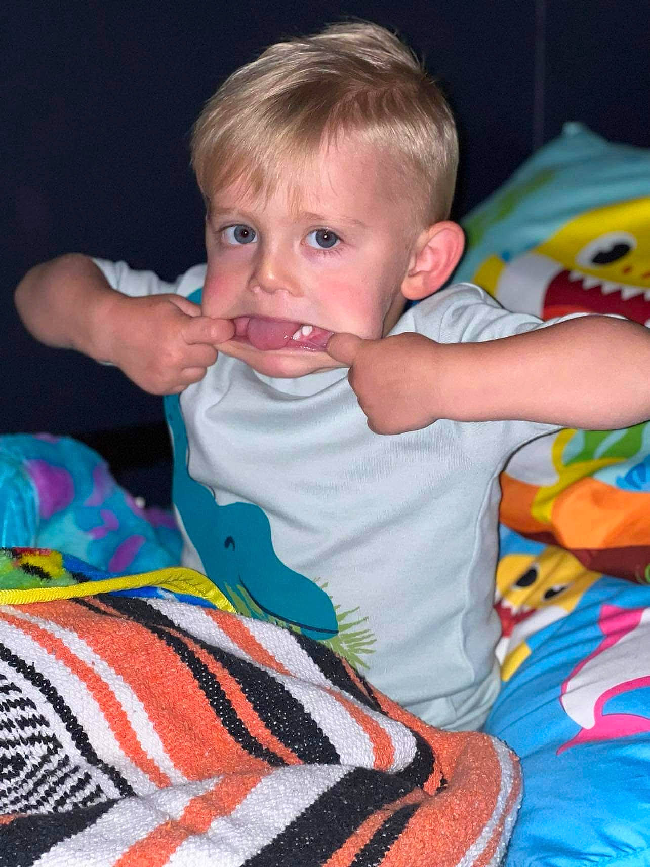 Kennedy is registered to the contest to win money with this photo: baby, baby_products, baby_toddler_clothing, cheek, child, comfort, face, finger, fun, happy, linens, pattern, people, person, play, room, sitting, sleeve, t_shirt, textile