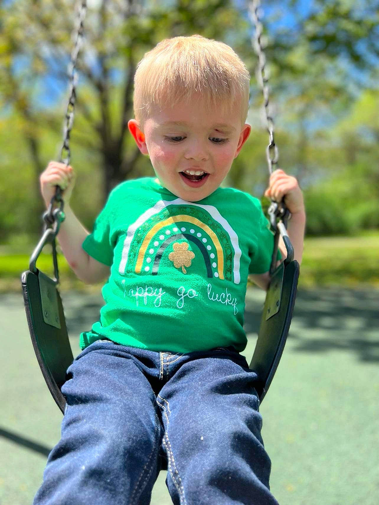 Kennedy joined the competition — help win amazing prizes! arm, baby_toddler_clothing, clothing, eye, face, facial_expression, grass, happy, head, leaf, leisure, mammal, people_in_nature, person, photograph, plant, skin, sleeve, smile, swing