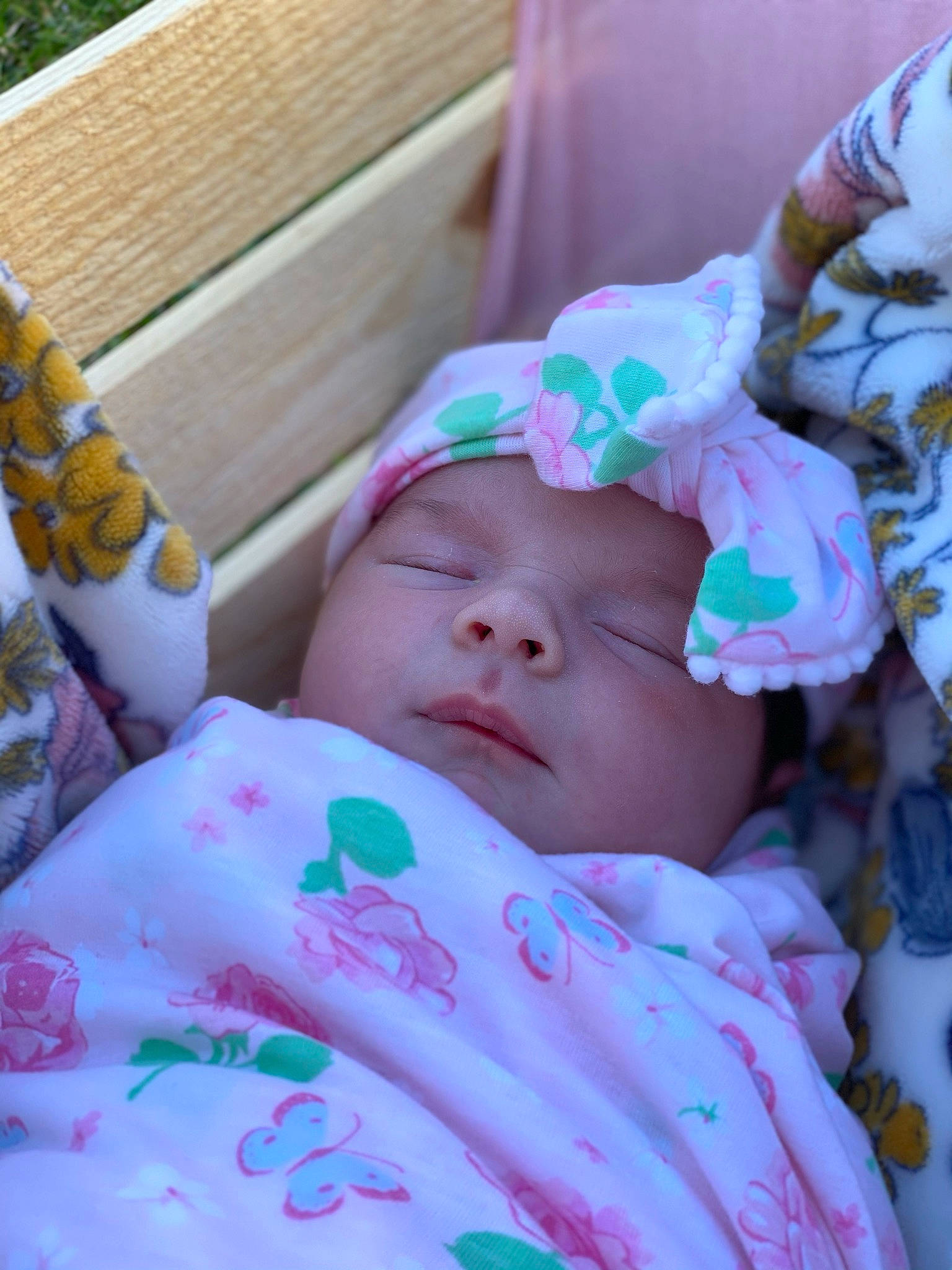 Allie joined the competition — help win amazing prizes! baby, baby_products, baby_toddler_clothing, bedtime, cheek, child, comfort, eyelash, face, grass, happy, hat, headwear, linens, magenta, outdoor_furniture, pattern, person, pink, sitting