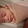 Magdalen is registered to the contest to win money with this photo: baby, sleeping, blanket, pink, stars, infant, child, face, closed_eyes, soft, bed, rest, peaceful, skin, person, cute, newborn, cozy, indoors, comfort