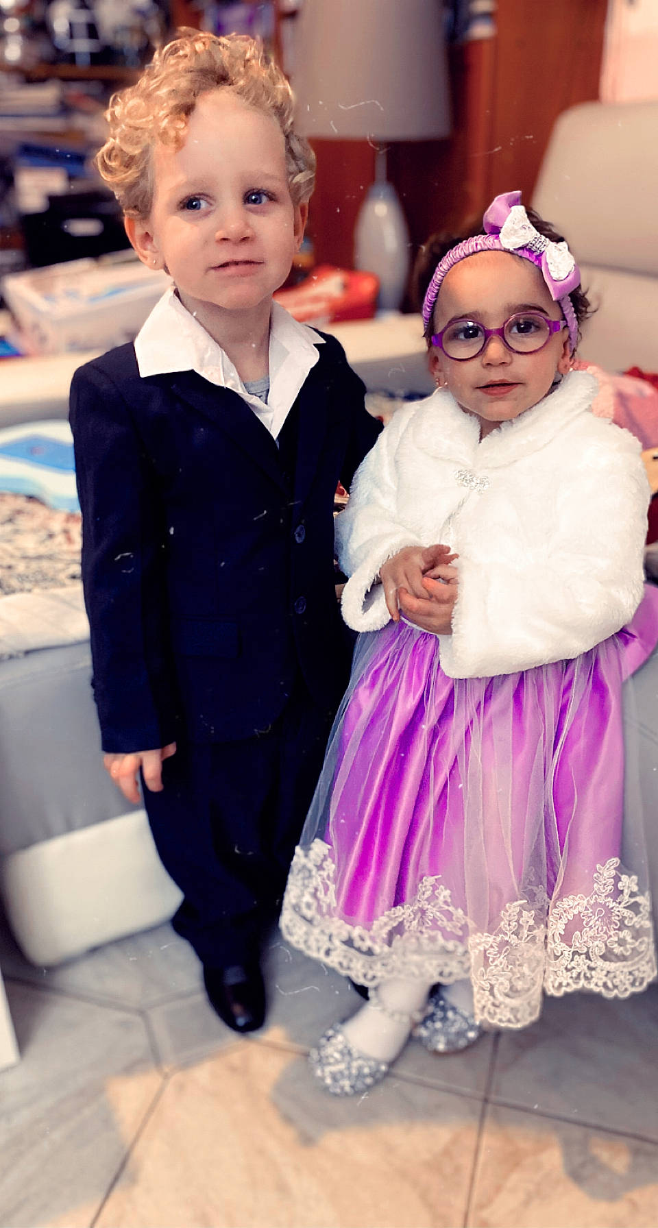 Tyler participe au concours pour gagner de l'argent avec cette photo : baby, bow_tie, dress, face, facial_expression, fashion, fun, hairstyle, happy, head, headgear, headwear, iris, people, person, photograph, pink, purple, skin, standing