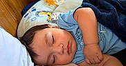Edwin joined the competition — help win amazing prizes! baby, blanket, blue_shirt, child, closeup, cushion, cute, face, indoors, infant, peaceful, pillow, portrait, relaxation, rest, sleep, sleeping, soft_lighting, toddler, wooden_wall