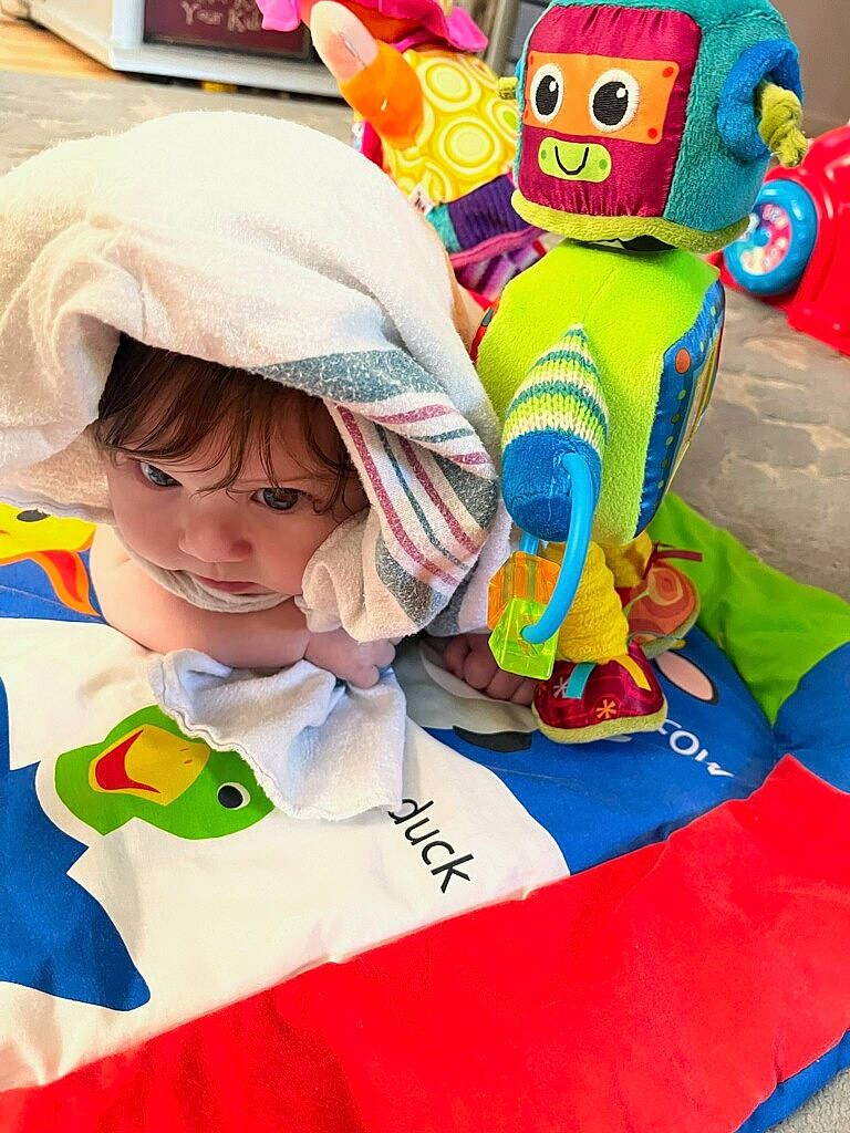 Emma Rose is registered to the contest to win money with this photo: animated_cartoon, animation, baby_toys, child, costume, event, fictional_character, fun, happy, leisure, linens, mammal, mascot, person, play, plush, product, room, stuffed_toy, textile