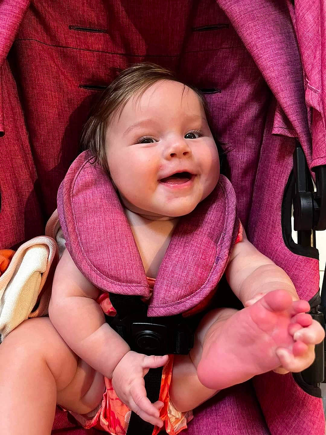 Emma Rose is registered to the contest to win money with this photo: baby, baby_carriage, baby_toddler_clothing, cheek, child, comfort, finger, gesture, hand, happy, lip, mouth, person, pink, red, skin, sleeve, smile, textile, thumb
