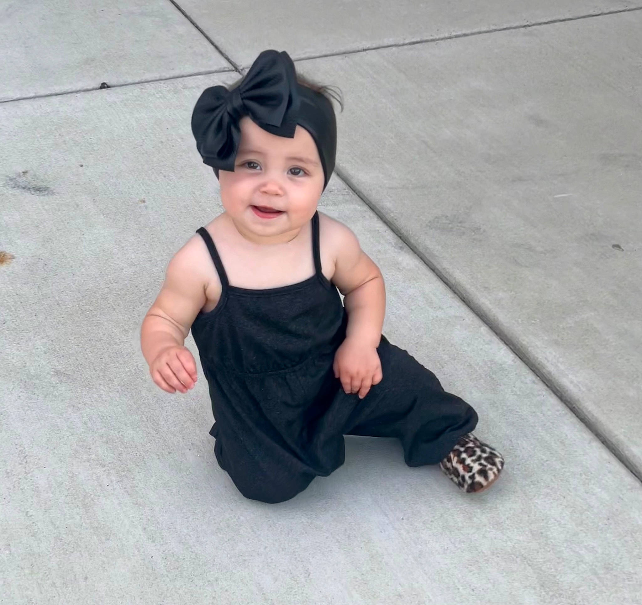 Evie is registered to the contest to win money with this photo: arm, baby, baby_toddler_clothing, child, chin, eye, face, flash_photography, flooring, fun, happy, hat, head, headwear, human_body, joy, leg, person, skin, sleeve