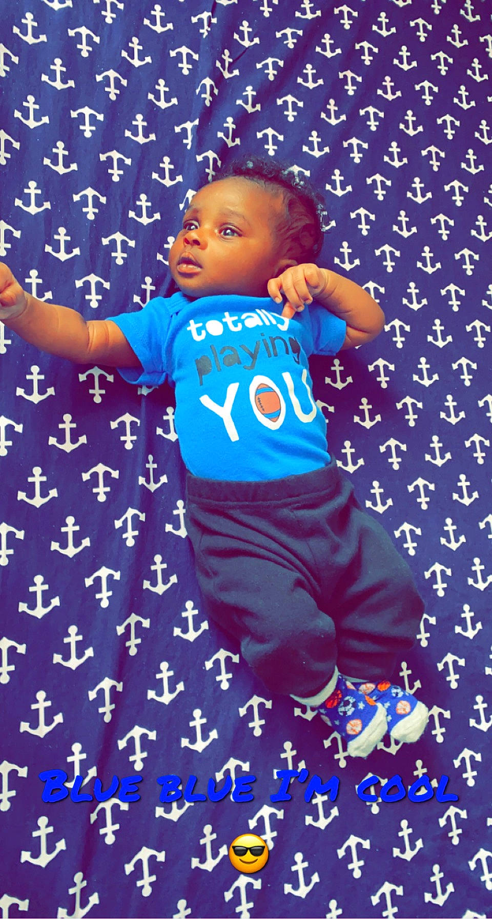 Jesiah is registered to the contest to win money with this photo: azure, baby, baby_toddler_clothing, child, electric_blue, flooring, font, fun, gesture, happy, pattern, people_in_nature, person, play, sleeve, t_shirt, thumb, toddler