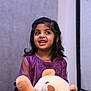 Tanvireddy joined the competition — help win amazing prizes! child, girl, teddy_bear, purple_dress, smiling, indoor, toy, happy, cute, portrait, young, holding, plush, person, face, black_hair, jewelry, small, looking_away, playful