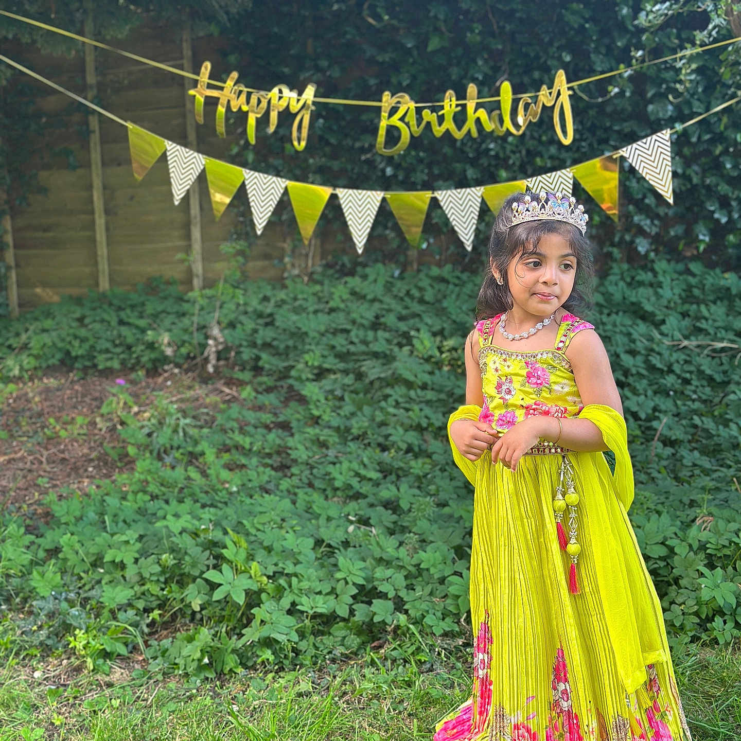 Tanvireddy is registered to the contest to win money with this photo: banner, birthday, celebration, child, dress, festive, garden, girl, grass, greenery, happy_birthday, nature, necklace, outdoor, party, pink_flowers, smiling, tiara, yellow_dress, young