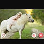 Kelly is registered to the contest to win money with this photo: child, girl, pony, unicorn, horn, dress, pink_dress, outdoor, nature, grass, path, animal, pet, smile, curly_hair, blonde, happy, riding, cute, photography