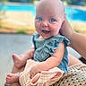 baby, blue_eyes, smiling, happy, infant, child, blanket, hand, outdoor, pool, greenery, summer, cute, portrait, person, clothing, skin, sitting, holding, soft_focus