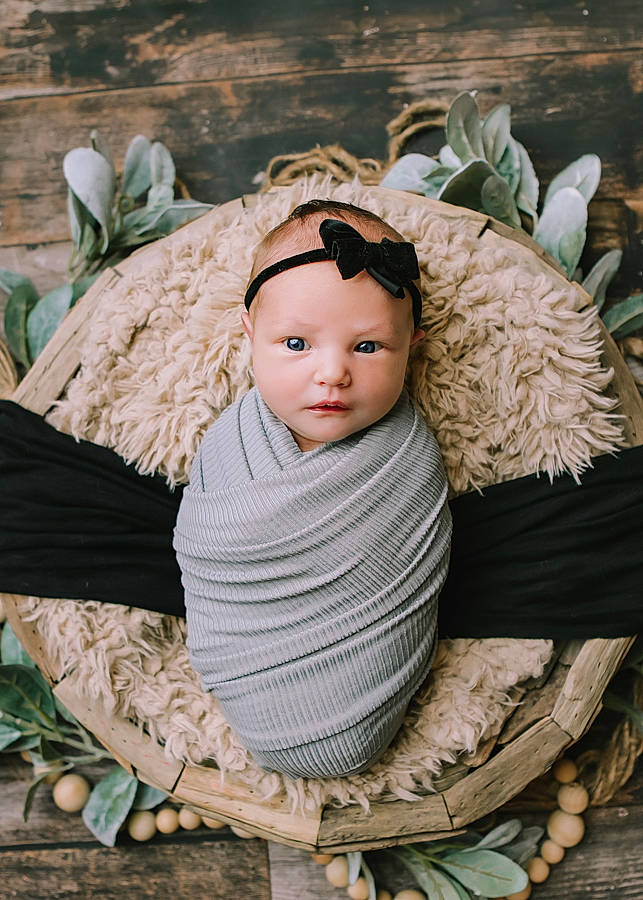 Camryn joined the competition — help win amazing prizes! baby, baby_products, baby_toddler_clothing, cap, child, costume_hat, doll, fashion_accessory, fur, grass, happy, headgear, headpiece, linens, pattern, person, sitting, textile, toddler, wood