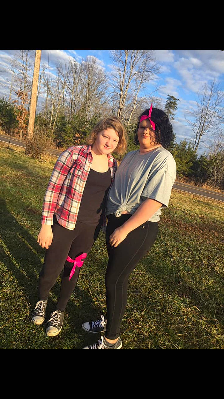 Tiffany is registered to the contest to win money with this photo: cool, design, footwear, friendship, fun, glasses, grass, happy, joy, leisure, love, pattern, people_in_nature, person, photo_shoot, photograph, photography, plaid, smile, tartan