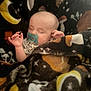 baby, sleeping, pacifier, blanket, stars, moon, leaves, cozy, infant, child, rest, peaceful, soft, warm, cute, portrait, indoor, face, hands, comfort