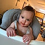 Kasen joined the competition — help win amazing prizes! baby, high_chair, food, messy_face, hands, indoor, kitchen, child, person, curious, brown_eyes, hair, skin, seat, straps, table, expression, home, cute, infant