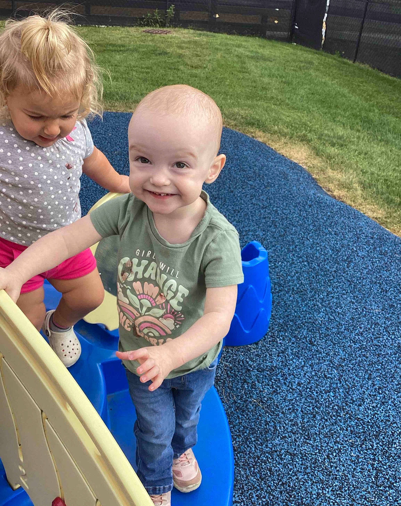 Helena joined the competition — help win amazing prizes! asphalt, baby, baby_toddler_clothing, child, cool, electric_blue, flooring, fun, grass, happy, joy, leisure, person, plant, play, recreation, shorts, sitting, smile, standing