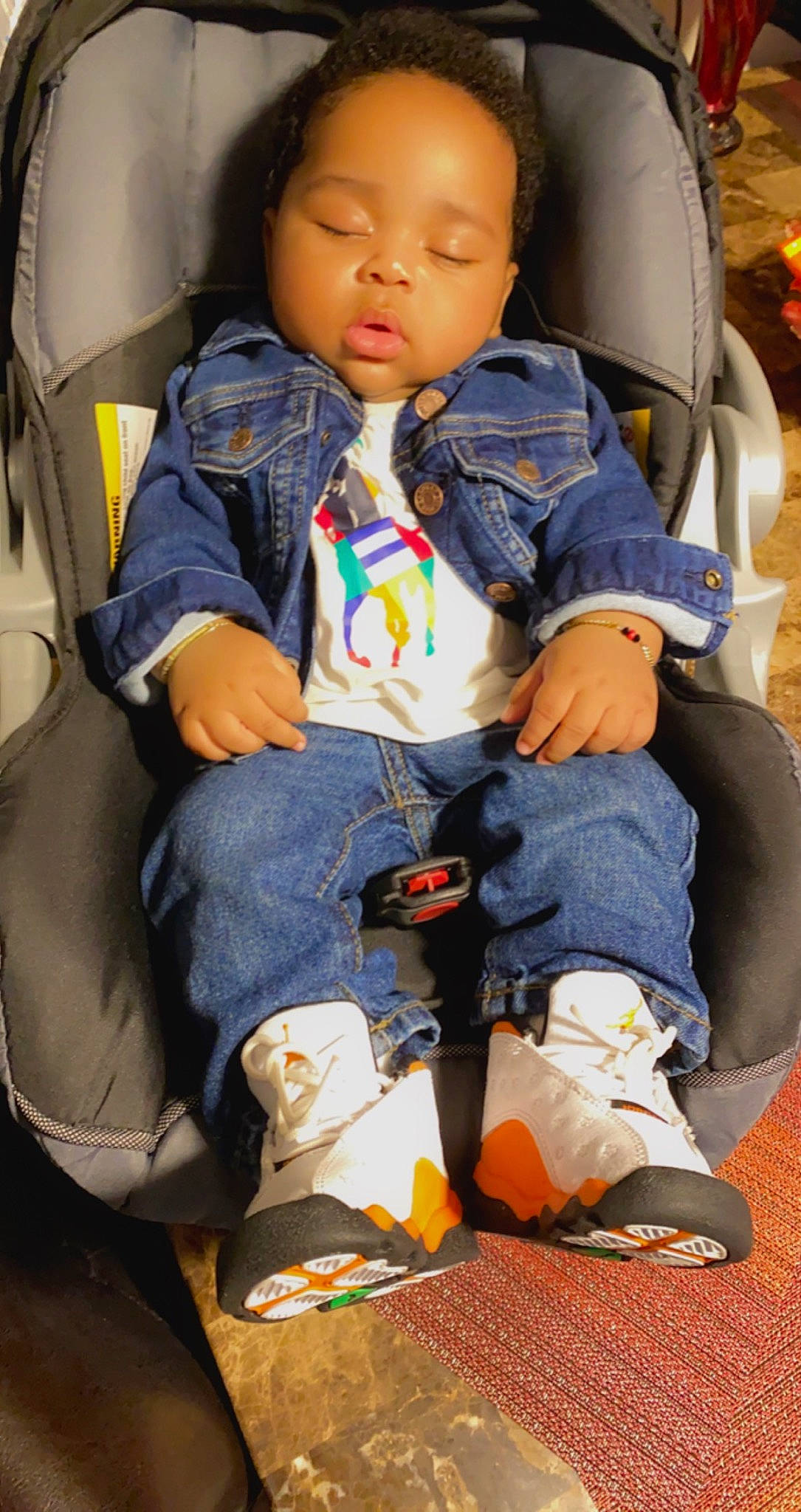 Chayce joined the competition — help win amazing prizes! baby_in_car_seat, bag, boot, car_seat, cheek, child, comfort, fun, hairstyle, human, knee, lap, leg, leisure, people, person, sitting, sneakers, toddler, travel
