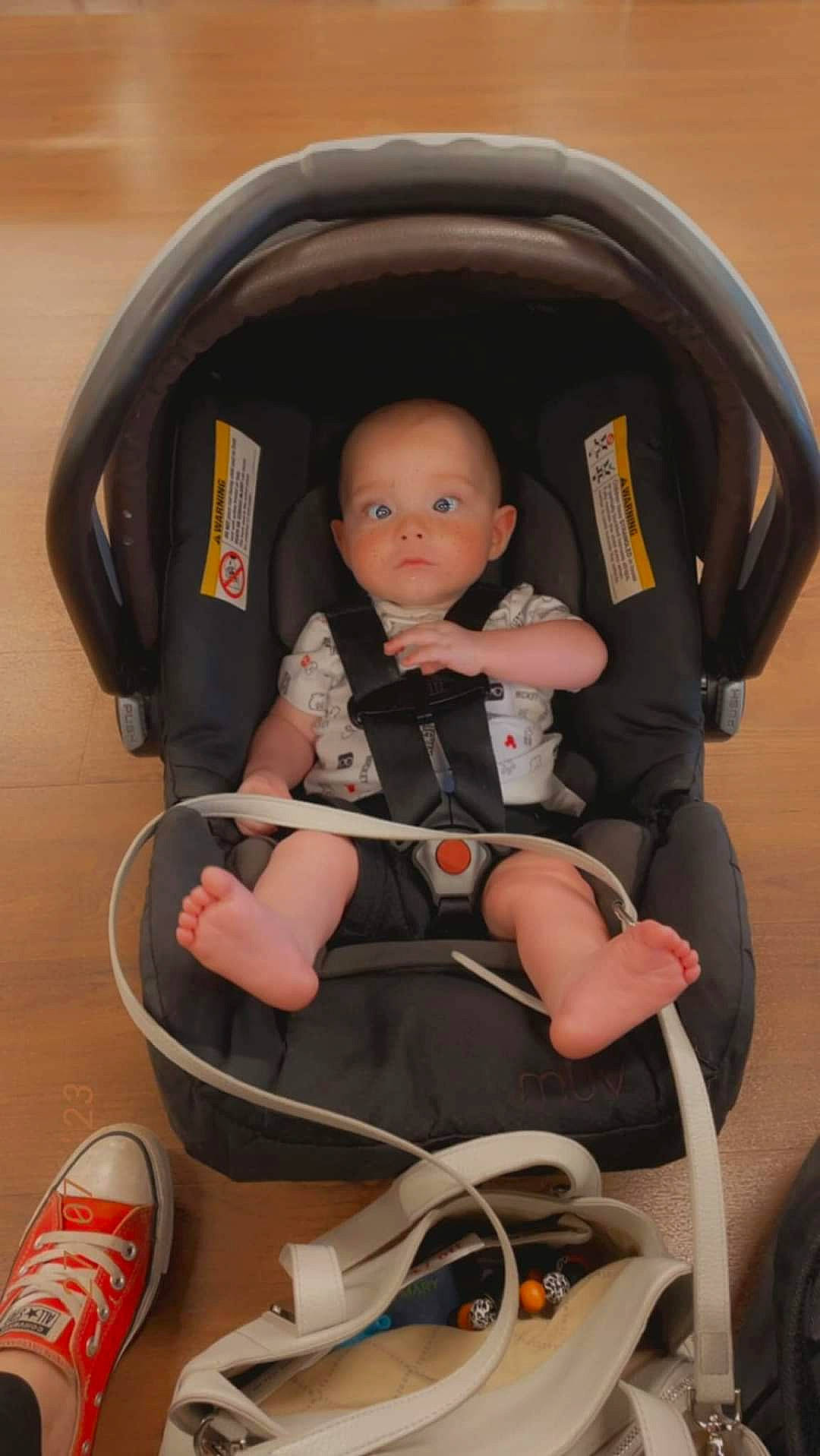 Parker is registered to the contest to win money with this photo: auto_part, automotive_design, baby, baby_carriage, baby_products, car_seat, carmine, chair, child, comfort, fun, human_leg, knee, lap, person, sitting, thigh, tire, toddler, toy