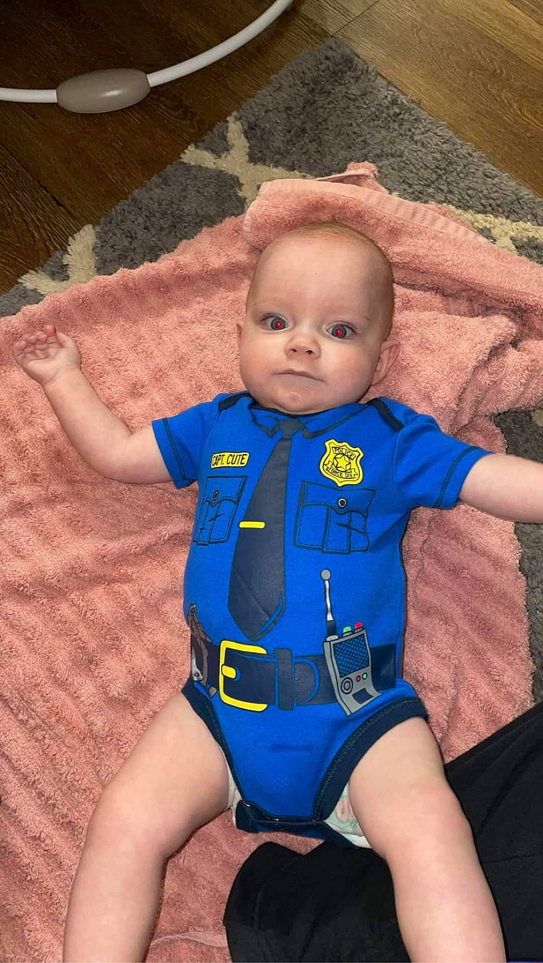 Parker is registered to the contest to win money with this photo: baby, baby_products, baby_toddler_clothing, cheek, child, comfort, electric_blue, face, finger, head, human_body, joint, lifejacket, outerwear, person, skin, sleeve, smile, textile, thigh