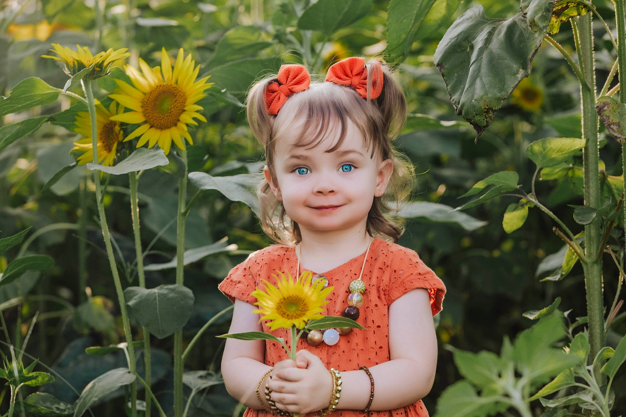 Shayleigh joined the competition — help win amazing prizes! annual_plant, baby_toddler_clothing, blond, botany, child, eye, flower, flowering_plant, grass, grass_family, happy, joy, leaf, people_in_nature, person, petal, plant, smile, summer, toddler