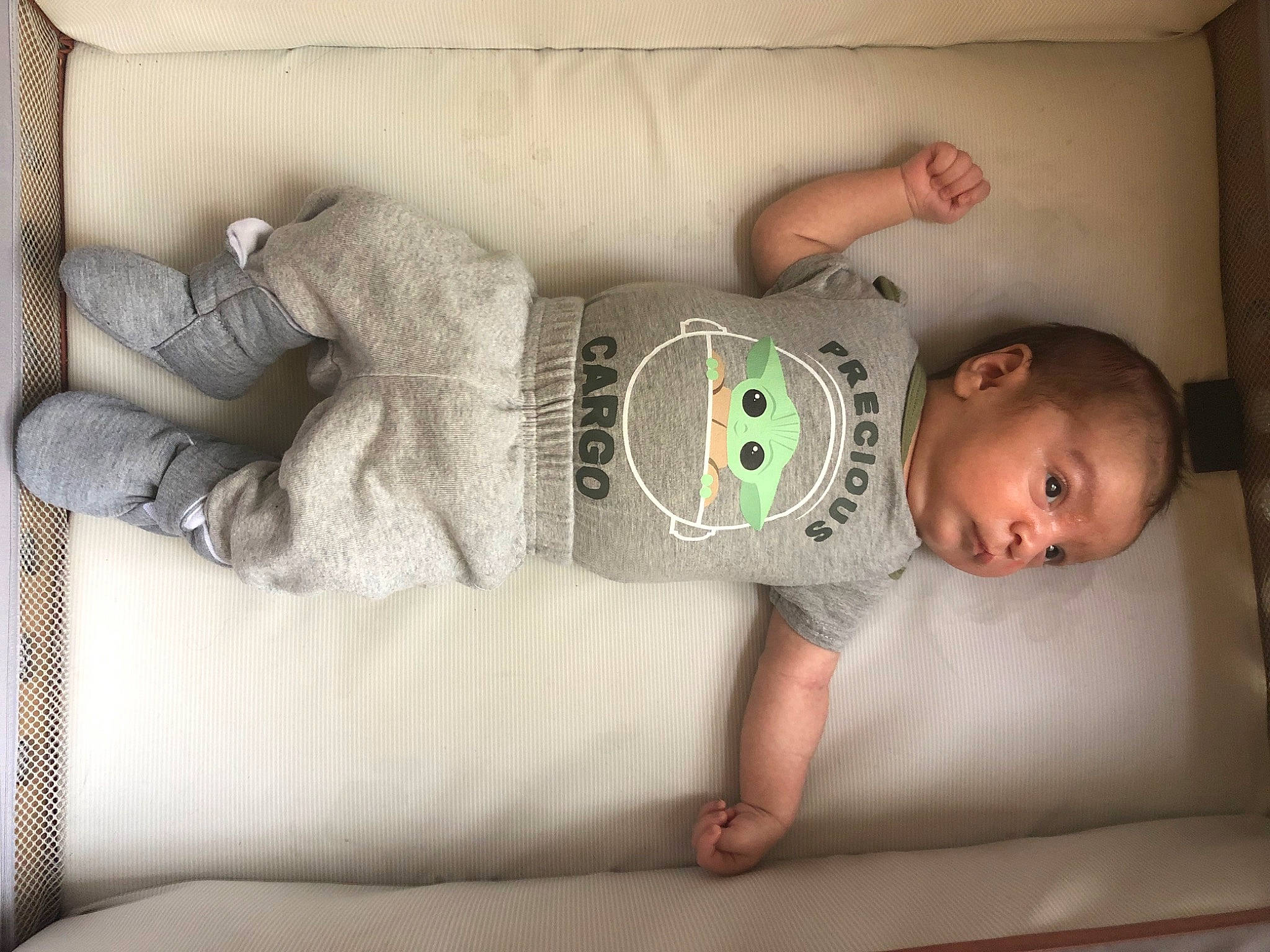 Phillip is registered to the contest to win money with this photo: baby, baby_toddler_clothing, comfort, elbow, floor, flooring, foot, human_leg, joint, knee, leg, linens, person, room, sleeve, sock, thigh, toddler, trunk, wood