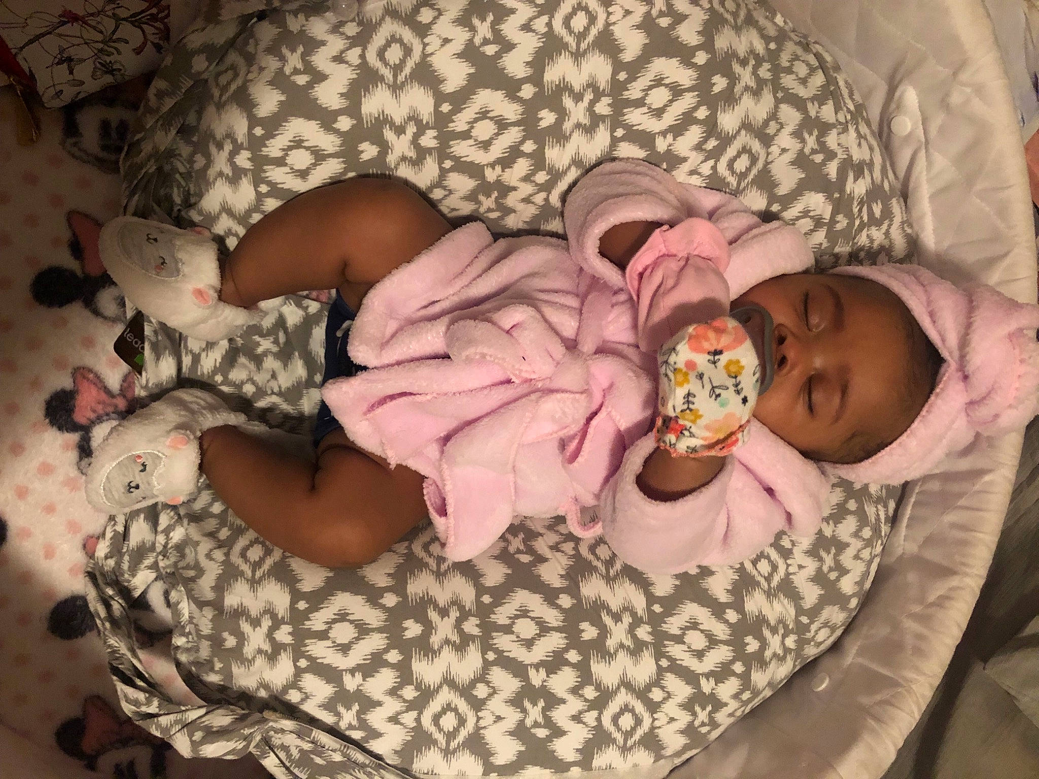Ayvah Larie is registered to the contest to win money with this photo: baby, baby_products, baby_sleeping, baby_toddler_clothing, cheek, child, comfort, event, headgear, human_body, linens, mammal, pattern, person, pink, product, room, sitting, skin, sweetness