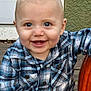 baby, child, smile, blue_eyes, plaid_shirt, pumpkin, autumn, outdoor, porch, wooden_floor, cute, happy, face, person, seasonal, fall, sitting, infant, casual_clothing, closeup