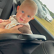 Niall joined the competition — help win amazing prizes! baby, blue_eyes, car_interior, car_seat, child, clothing, cute, face, hands, head, holding_hands, human, infant, person, seat, sitting, smile, transportation, vehicle, window