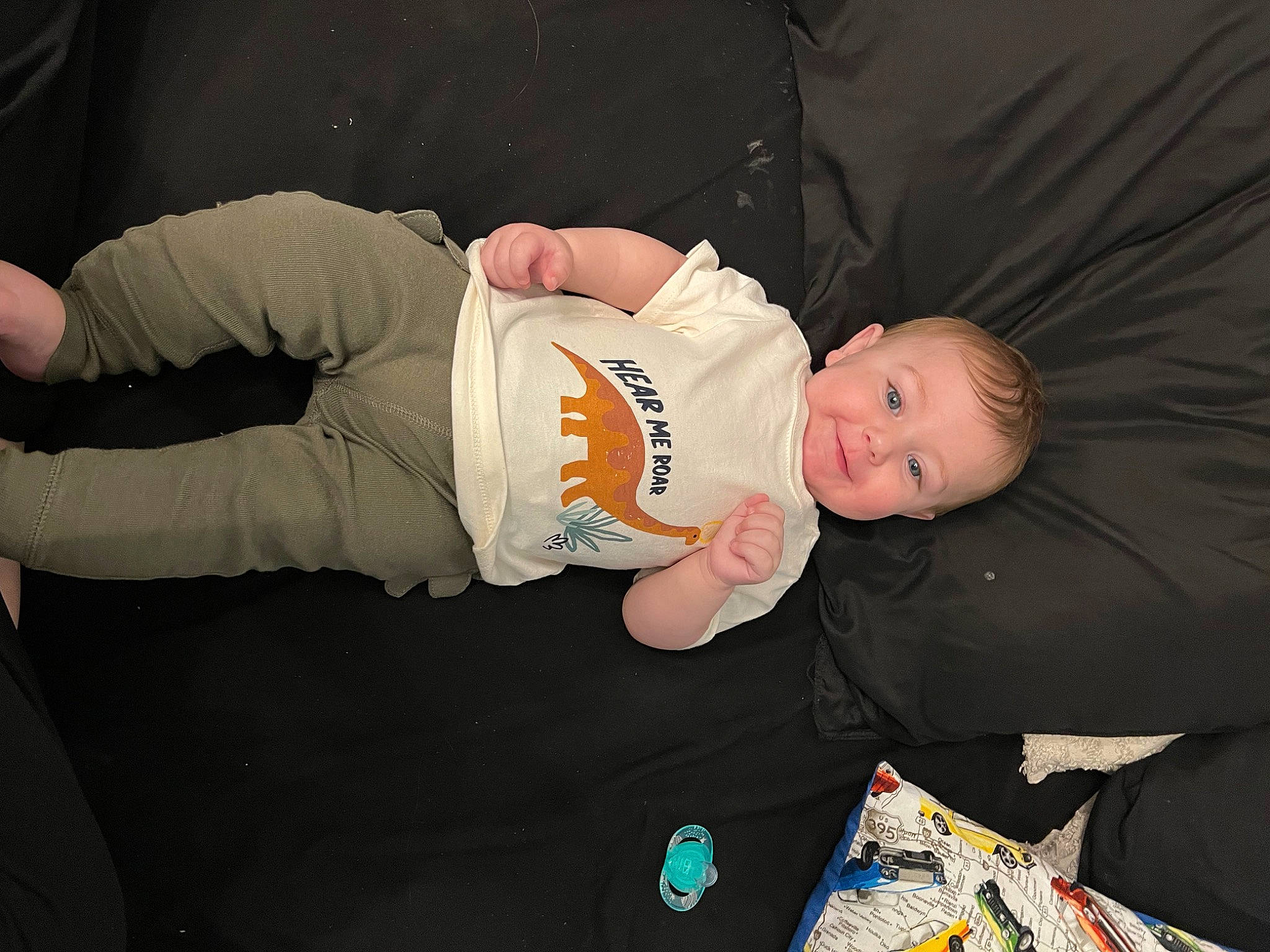 Colsyn is registered to the contest to win money with this photo: baby, baby_products, baby_toddler_clothing, child, comfort, elbow, fun, lap, person, room, sitting, sleeve, smile, toddler