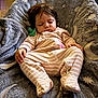 Emry is registered to the contest to win money with this photo: baby, sleeping, pajamas, blanket, stars, moon, cozy, child, indoor, floor, soft, cute, infant, rest, comfort, peaceful, footed_pajamas, nap, young_child, sleep
