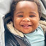 toddler, smiling, child, face, jacket, coat, stroller, baby, happy, cute, portrait, closeup, young_child, clothing, warm, seatbelt, outdoor, person, head, expression