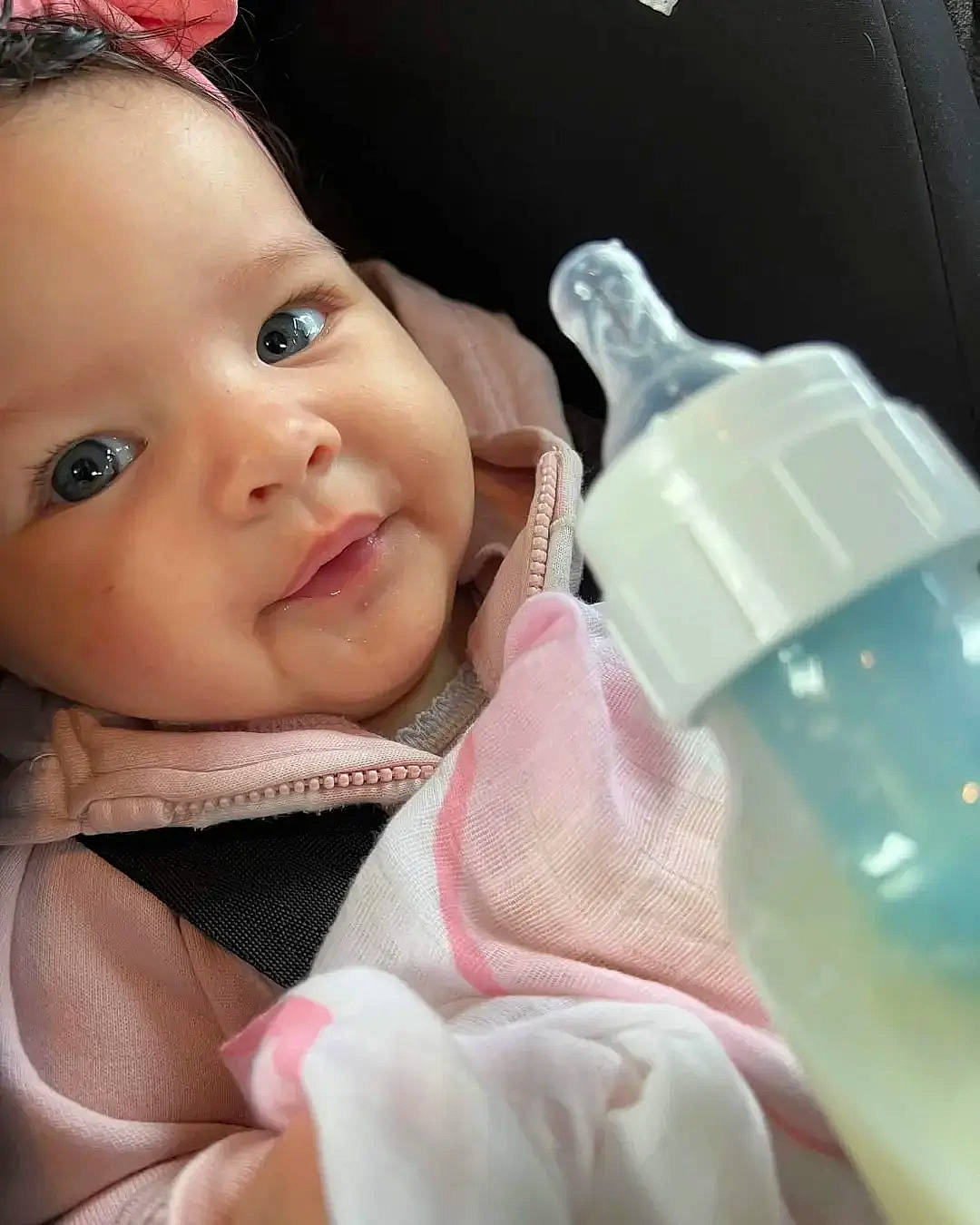 Ruth joined the competition — help win amazing prizes! baby, baby_toddler_clothing, bottle, cheek, child, drinkware, eyelash, finger, happy, iris, lip, nose, person, plastic_bottle, product, skin, sleeve, smile, thumb, toddler