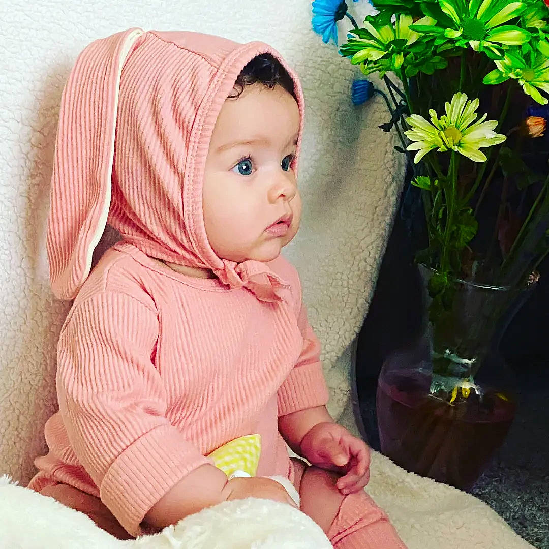 Ruth joined the competition — help win amazing prizes! annual_plant, baby, baby_toddler_clothing, cap, child, comfort, fashion_accessory, flower, flower_arranging, flowerpot, grass, happy, headwear, herbaceous_plant, knit_cap, pattern, person, petal, plant, skin