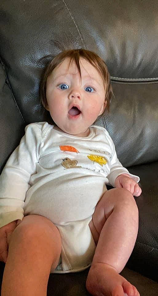 Kaisley joined the competition — help win amazing prizes! baby, baby_toddler_clothing, blond, cheek, child, comfort, eye, finger, head, human_leg, iris, knee, lip, nose, organ, person, sitting, skin, sleeve, surprise
