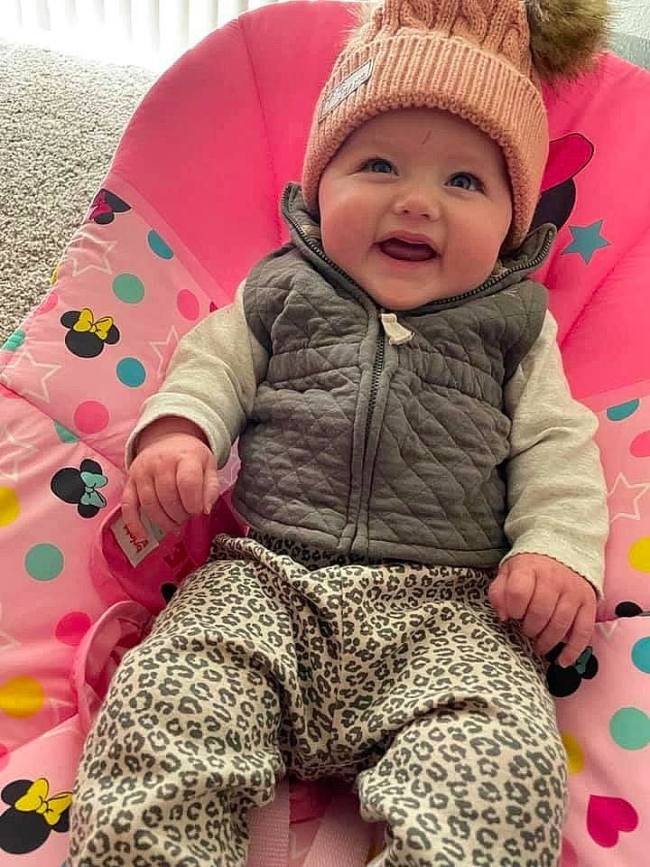 Kaisley joined the competition — help win amazing prizes! baby, baby_toddler_clothing, cap, cheek, clothing, comfort, eye, face, facial_expression, head, headwear, organ, outerwear, person, photograph, pink, product, skin, sleeve, smile