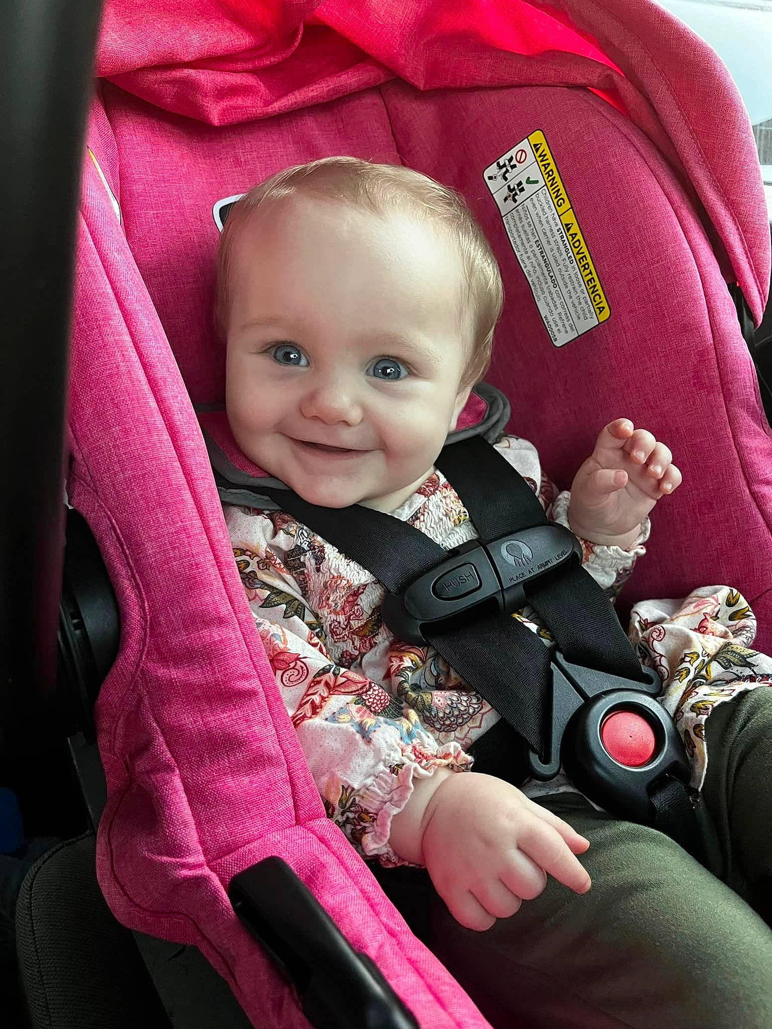 Alexis is registered to the contest to win money with this photo: baby, baby_carriage, baby_products, baby_toddler_clothing, car_seat, child, comfort, facial_expression, fun, gesture, human, human_body, joy, lap, person, pink, product, seat_belt, skin, sleeve