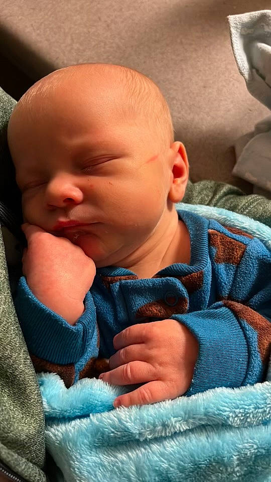 Carter joined the competition — help win amazing prizes! baby, baby_in_car_seat, baby_products, baby_sleeping, baby_toddler_clothing, cheek, child, chin, comfort, electric_blue, eyebrow, finger, gesture, linens, mouth, nose, orange, person, skin, thumb