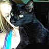 Pepsi Gerald joined the competition — help win amazing prizes! animal, black_cat, blonde_hair, blue_clothing, cat, close_up, decor, face, feline, green_eyes, holding, home, human, indoor, looking, person, pet, portrait, purple_clothing, tank_top