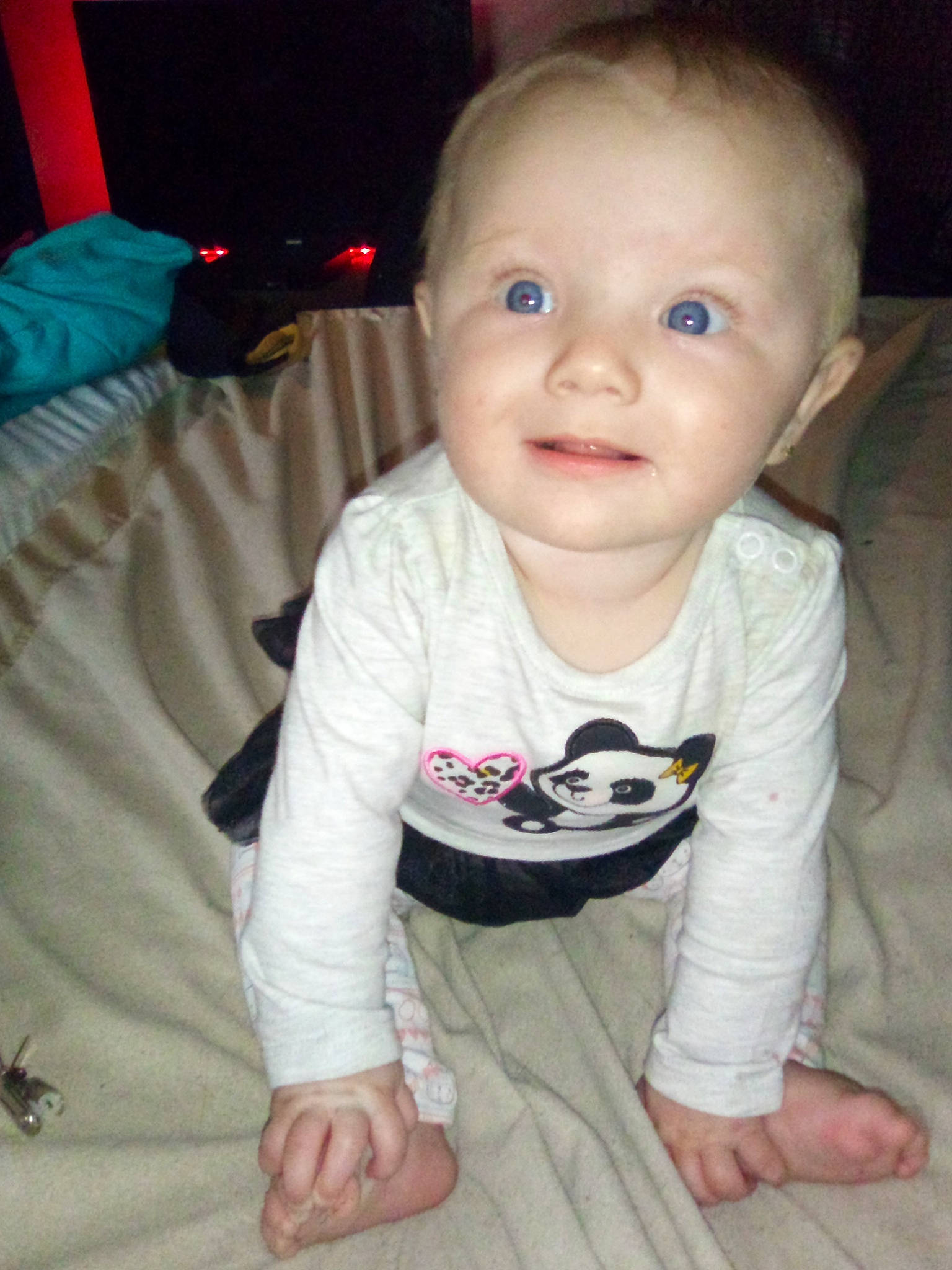 Breanna is registered to the contest to win money with this photo: baby, baby_toddler_clothing, cheek, child, comfort, face, finger, flooring, hair, head, human_body, iris, joy, mammal, mouth, nose, person, product, skin, sleeve